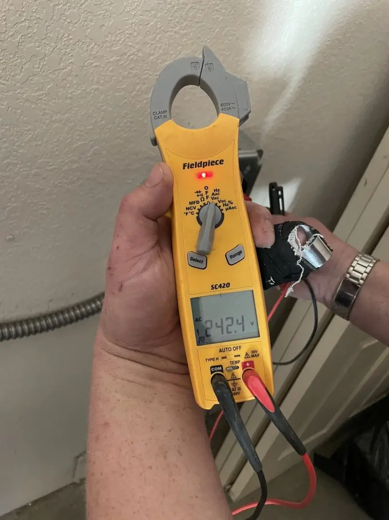 Voltage testing with clamp meter during Electrical Installation Services in Mount Clemens